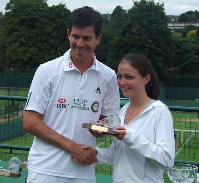 Amy Ellis being presented with her trophy by Tim Henman